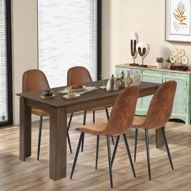 A set of 4 grey fabric-backed and metal combination spoon chairs - a perfect match for minimalist and Scandinavian-style home decor