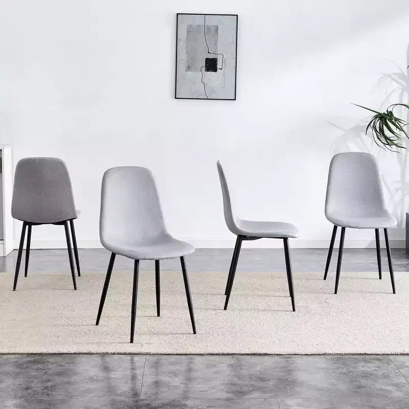 A set of 4 grey fabric-backed and metal combination spoon chairs - a perfect match for minimalist and Scandinavian-style home decor